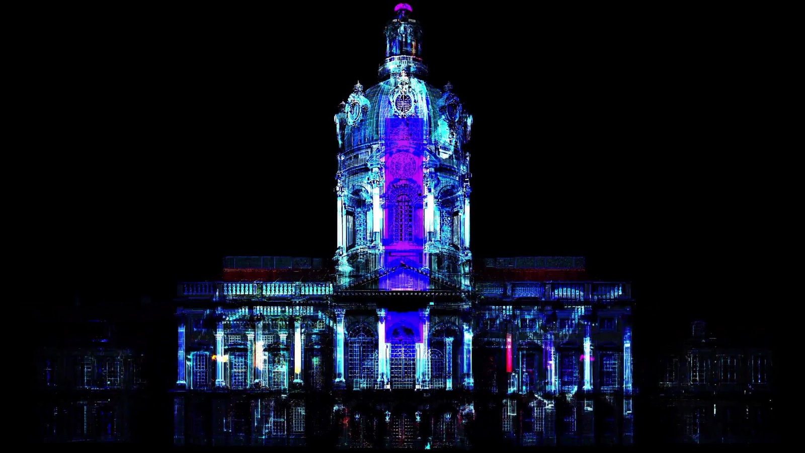 The façade of Charlottenburg Palace in Berlin covered in a red and white ornamental projection mapping during the Festival of Lights