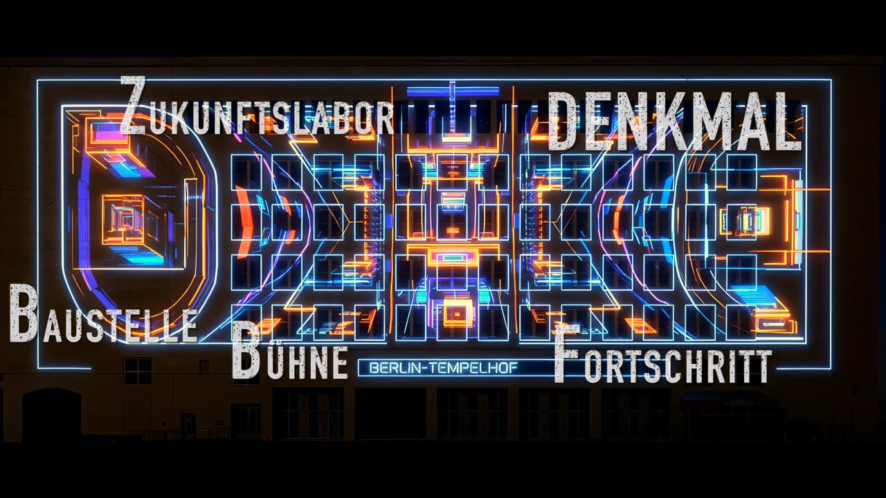 The tower of the former Tempelhof Airport in Berlin with projected words such as Zukunftslabor, Denkmal, Baustelle and Bühne during the Festival of Lights 2025